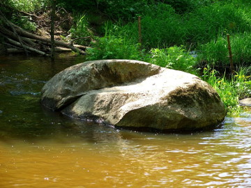 The river Aitra. The boulder Velnio Krase